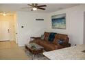 Living room with a comfortable sectional sofa and large wall art at 11919 Grand Kempston Dr, Gibsonton, FL 33534