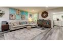Living room with L-shaped sofa, eclectic decor, and view of kitchen at 2219 Beach S Blvd, Gulfport, FL 33707