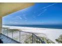 Expansive balcony view overlooking a pristine beach and clear blue ocean at 15 Somerset St # 6A, Clearwater Beach, FL 33767