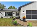 Front view of a renovated house with landscaping at 12493 Fish Cove Dr, Spring Hill, FL 34609