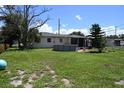 Large grassy backyard with above ground pool at 2109 58Th S St, Gulfport, FL 33707