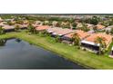 Community view showcasing homes with water access and lush landscaping at 4943 Sandy Brook Cir, Wimauma, FL 33598