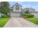 Two-story townhome with attached garage and landscaping at 1034 Bella Vista Ne Dr, St Petersburg, FL 33702