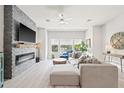 Modern living room features a cozy fireplace, ample natural light, and stylish decor at 2510 W Cleveland St # 2, Tampa, FL 33609
