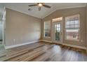 Bright living room featuring vaulted ceiling, wood floors and ample natural light at 5000 Culbreath Key Way # 4-306, Tampa, FL 33611