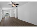 Bright and airy living room with hardwood floors at 13064 Meadow Swallow Ave, Weeki Wachee, FL 34614