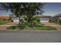 Two-car garage home with nicely landscaped yard at 15626 Aurora Lake Cir, Wimauma, FL 33598
