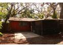 Exterior shot of home with fenced yard and screened lanai at 709 1St Ne Ave, Largo, FL 33770