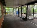 Screened porch with access to backyard at 709 1St Ne Ave, Largo, FL 33770