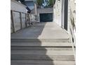 Wooden deck with chairs, perfect for outdoor relaxation and enjoying the surrounding scenery at 21027 Lazy Days Cir, Lutz, FL 33558
