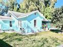 Charming light blue house with front yard at 1478 Alternate Keene Rd, Largo, FL 33771