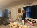Bright dining room features a table with chairs, ready for Gathering meals at 9463 Arbol Ct, Largo, FL 33773