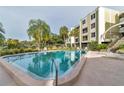 Inviting community pool with lounge chairs at 4681 1St Ne St # 309, St Petersburg, FL 33703