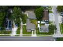 An aerial view of the house, showcasing its position on a tree-lined street at 911 8Th Sw Ave, Largo, FL 33770