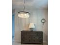 Dining room featuring a gray dresser and unique lighting at 11086 Sundrift Dr, Tampa, FL 33647