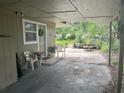 Small backyard with patio and seating area at 1874 Douglas Ave, Clearwater, FL 33755
