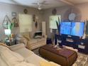 Living room with neutral colored couch and coffee table at 1874 Douglas Ave, Clearwater, FL 33755