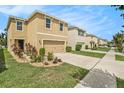Two-story house with driveway, landscaping and a white fence at 3508 Diamond Leaf Ct, Valrico, FL 33594