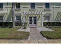 Building exterior showcasing a light green building with a walkway at 5144 Salmon Se Dr # A, St Petersburg, FL 33705