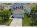 Two-story house with attached garage, aerial view at 12124 Tree Haven Ave, Gibsonton, FL 33534