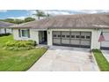 Exterior of a condo with a carport and American flag at 2507 Lancaster Dr, Sun City Center, FL 33573