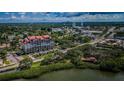 Aerial view of building near waterfront and city skyline at 7037 Sunset S Dr # 602, South Pasadena, FL 33707