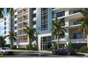Modern building exterior with parking and street access at 411 E Shore Drive # 213, Clearwater Beach, FL 33767