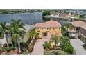 Beautiful two-story home with lush landscaping and waterfront views at 1233 Acappella Ln, Apollo Beach, FL 33572