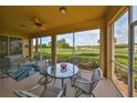 Enjoy the view from this screened porch with seating at 1359 Emerald Dunes Dr, Sun City Center, FL 33573