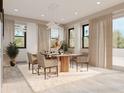 Elegant dining room with a large table, six chairs, and large windows at 5221 29Th S Ave, St Petersburg, FL 33707