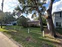 View of a light pink house from the street at 3305 W Oakellar Ave, Tampa, FL 33611
