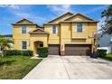 Two-story house with double garage at 10820 Carloway Hills Drive, Wimauma, FL 33598