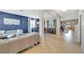 Open living and dining area with tiled floors at 10820 Carloway Hills Drive, Wimauma, FL 33598