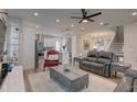 Open living room showcasing a comfortable seating arrangement, a large TV, and an adjoining kitchen at 2860 14Th N Ave, St Petersburg, FL 33713