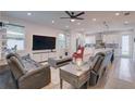 Spacious living room with comfortable leather couches, a large TV, and an open concept design at 2860 14Th N Ave, St Petersburg, FL 33713