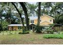 Two-story house with carport and landscaped yard at 315 Wooten Rd, Lutz, FL 33548