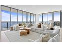 Spacious living room with floor to ceiling windows and water views at 2912 W Santiago St # Ph2402, Tampa, FL 33629