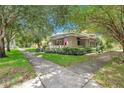 Charming bungalow with a well-manicured lawn and mature trees at 455 13Th Ne Ave, St Petersburg, FL 33701