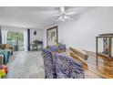 Dining area with wood table, chairs, and access to patio at 3730 42Nd S Way # G, St Petersburg, FL 33711