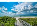 Boardwalk path to beach with ocean view at 724 Gulf Blvd # A & B, Indian Rocks Beach, FL 33785