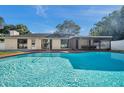 Inviting kidney-shaped pool in the backyard at 1164 Murok S Way, St Petersburg, FL 33705