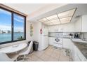 Clean kitchen with white cabinets and water views at 6218 Palma Del Mar S Blvd # 606, St Petersburg, FL 33715