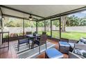 Screened patio with seating and backyard view at 205 Se Monroe N Cir, St Petersburg, FL 33703