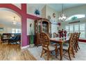 Elegant dining room featuring a large wood table and hutch at 11426 Glenmont Dr, Tampa, FL 33635