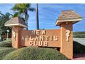 New Atlantis Club entrance sign with seahorse accents at 12760 Indian Rocks Rd # 1004, Largo, FL 33774