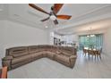 Open living space with sectional sofa and kitchen view at 6378 Camino Dr, Apollo Beach, FL 33572
