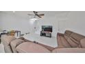 Spacious living room with two sofas and a TV at 6378 Camino Dr, Apollo Beach, FL 33572