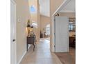 Bright and spacious entryway with tile flooring and a view of the living area at 10713 Cape Hatteras Dr, Tampa, FL 33615