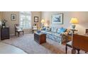 Cozy living room featuring comfortable seating and large windows at 10713 Cape Hatteras Dr, Tampa, FL 33615