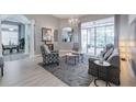 Spacious living room with light flooring and access to the patio at 5014 Ruby Flats Dr, Wimauma, FL 33598
